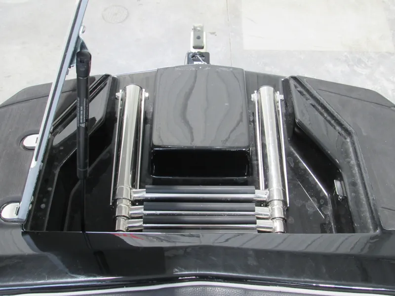 Slide: The Image of 2020 Malibu M240 boat engine compartment with polished metal components. - 11