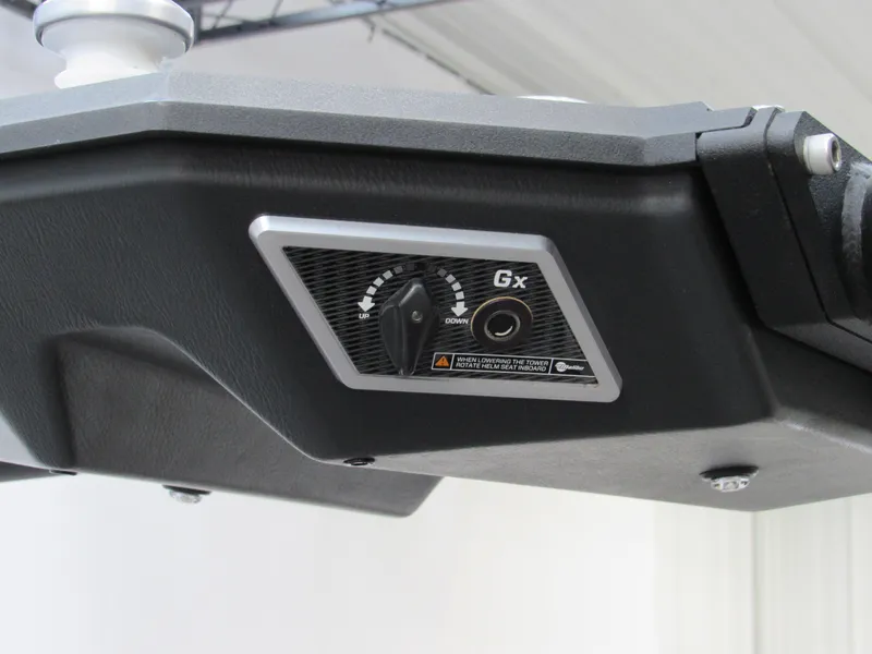 Slide: The Image of Close-up of 2020 Malibu M240 boat control panel with adjustment knob. - 14