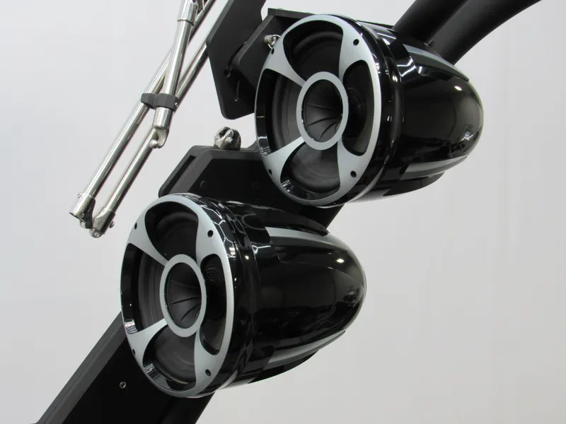 Slide: The Image of 2020 Malibu M240 boat speakers, sleek black design, mounted on a metal frame. - 15