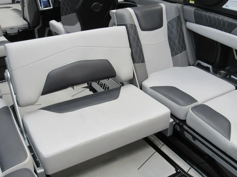 Slide: The Image of 2020 Malibu M240 boat interior with gray and white seating, featuring modern design and comfort. - 16
