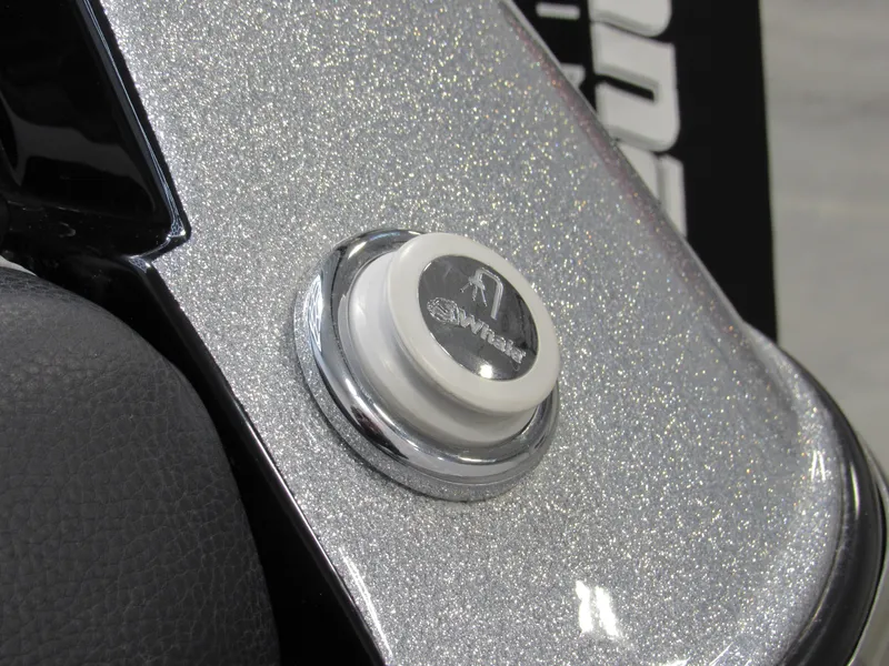 Slide: The Image of Close-up of 2020 Malibu M240 boat detail with metallic finish and button. - 20