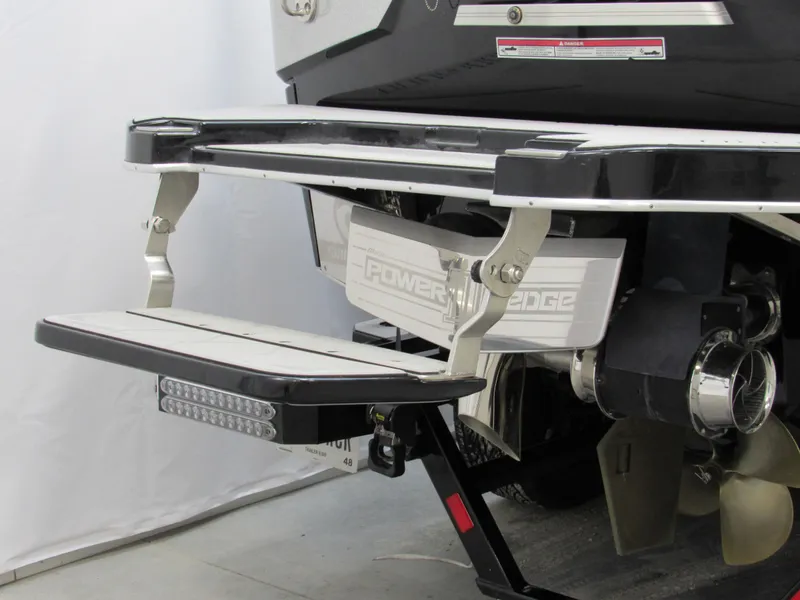 Slide: The Image of 2020 Malibu M240 boat stern with swim platform and propeller detail. - 3