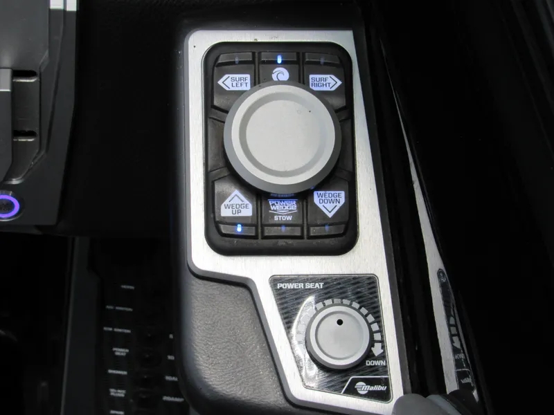 Slide: The Image of Control panel of a 2020 Malibu M240 boat with various adjustment buttons. - 9