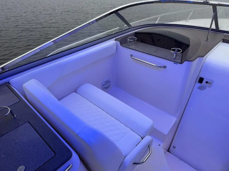 Slide: The Image of 2005 Regal 3350 Sport Cruiser interior with seating and cup holders. - 14