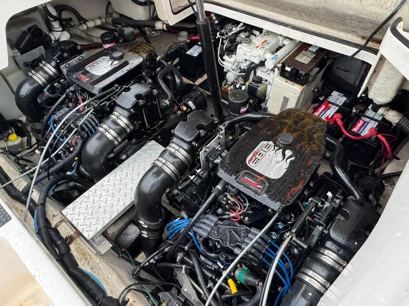 Slide: The Image of Engine compartment of a 2005 Regal 3350 Sport Cruiser with dual engines and batteries. - 31