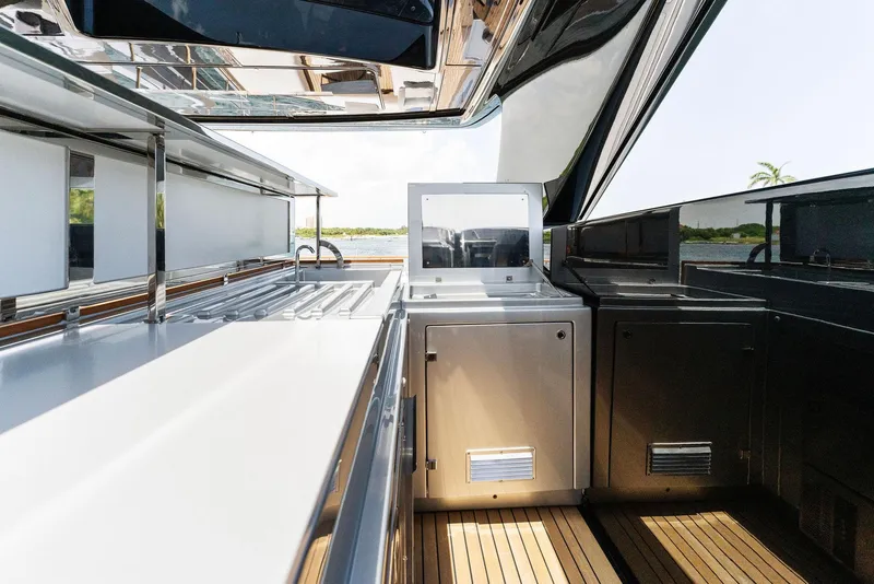 Slide: The Image of Luxurious 2023 Riva Dolcevita yacht kitchen with modern appliances and sleek design. - 12