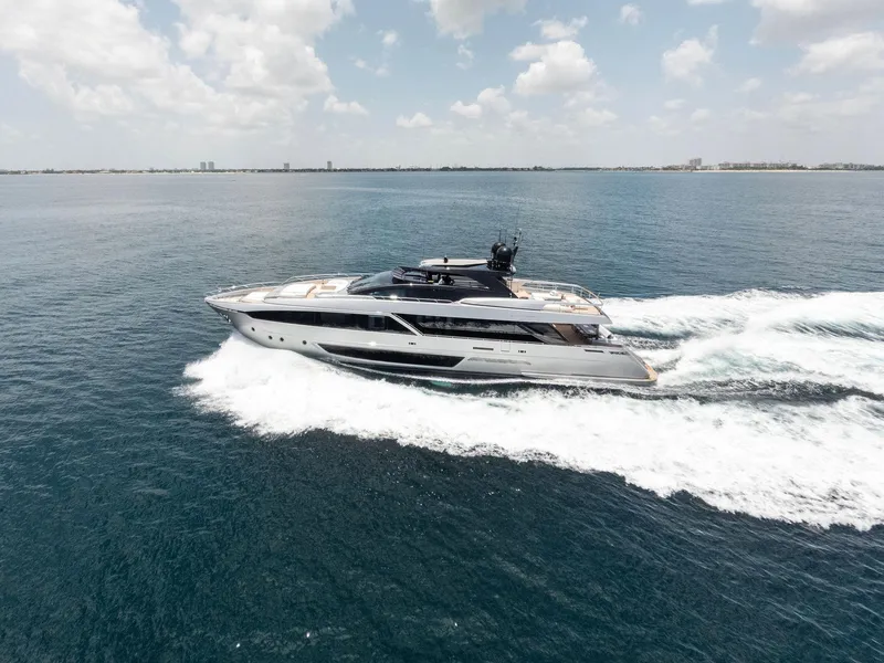 Slide: The Image of Luxury 2023 Riva Dolcevita yacht cruising on open sea under cloudy sky. - 3