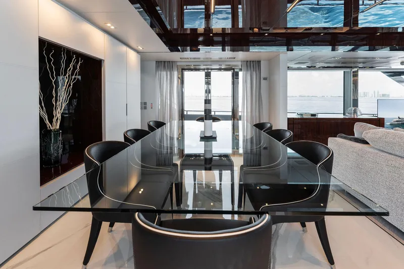 Slide: The Image of Luxurious interior of 2023 Riva Dolcevita yacht with modern dining area and ocean view. - 40