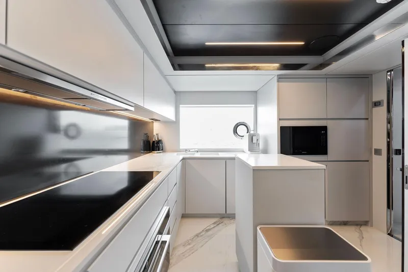 Slide: The Image of Modern kitchen interior on 2023 Riva Dolcevita yacht with sleek appliances and minimalist design. - 46