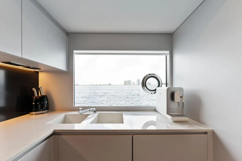 Slide: The Image of Modern kitchen with stainless steel appliances on a 2023 Riva Dolcevita yacht. - 48