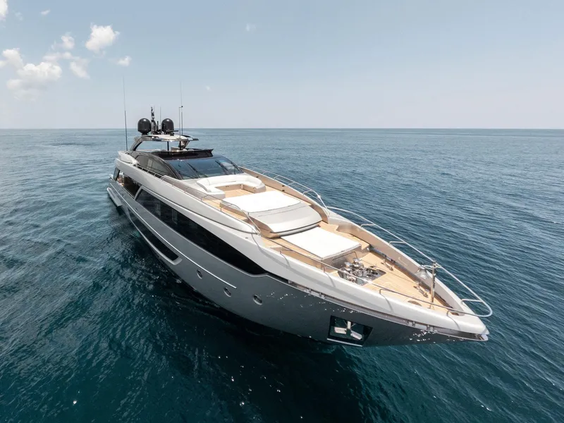 Slide: The Image of 2023 Riva Dolcevita yacht cruising on open sea under clear sky. - 5