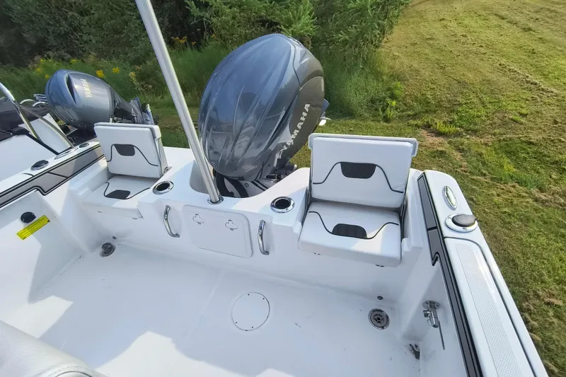 Slide: The Image of 2025 Wellcraft 202 Fisherman boat with Yamaha outboard motor, featuring seating and storage. - 13