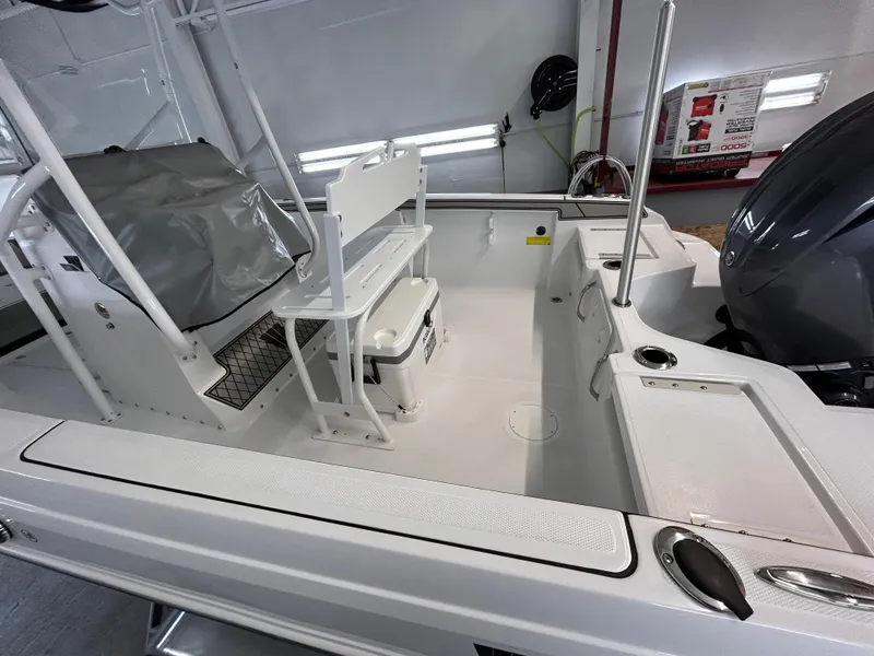 Slide: The Image of 2025 Wellcraft 202 Fisherman boat interior with seating and storage features. - 7