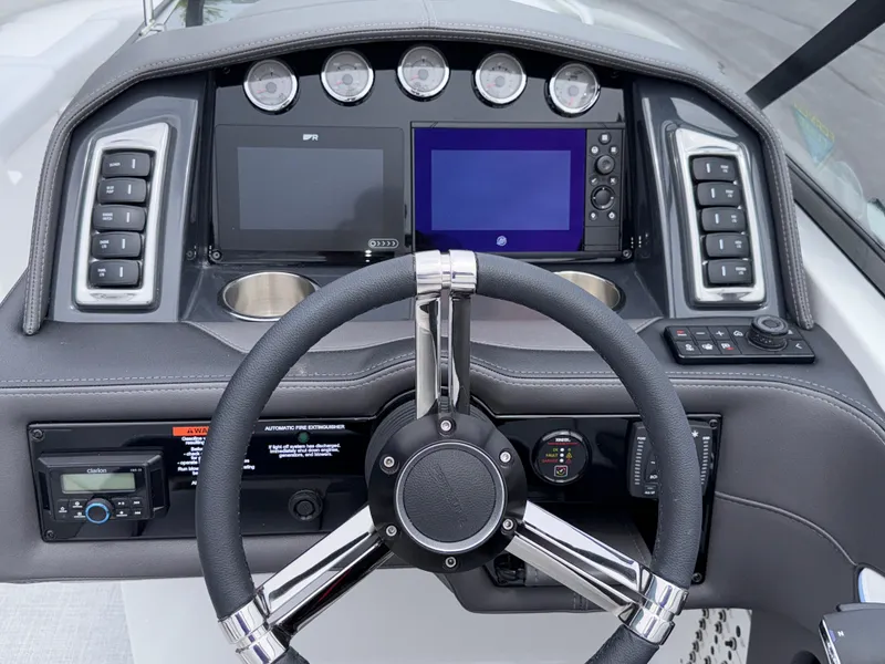 Slide: The Image of Steering console of 2025 Formula 270 Bowrider with modern navigation displays and controls. - 15