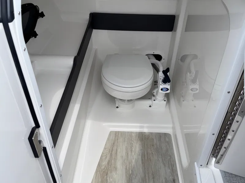 Slide: The Image of 2025 Formula 270 Bowrider boat interior with compact marine toilet and modern design. - 18