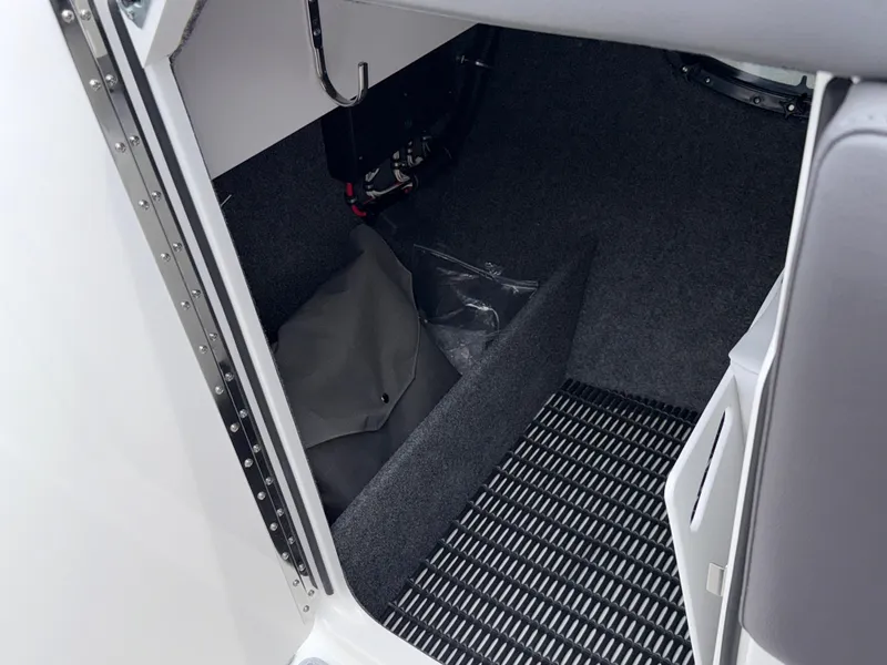 Slide: The Image of Interior storage compartment of 2025 Formula 270 Bowrider boat, featuring carpeted flooring. - 19