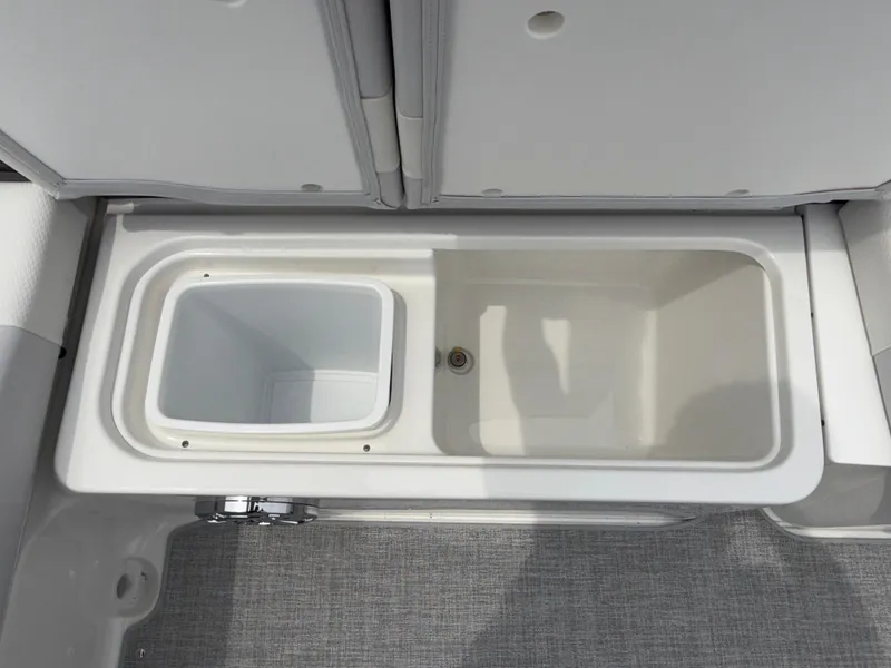 Slide: The Image of 2025 Formula 270 Bowrider storage compartment with integrated cooler and drain. - 23