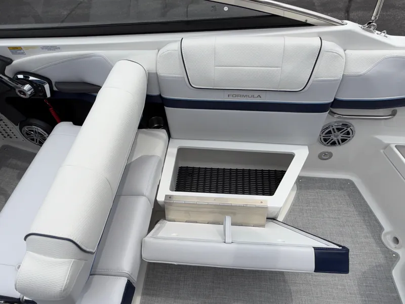 Slide: The Image of 2025 Formula 270 Bowrider interior with white seating and storage compartment. - 25