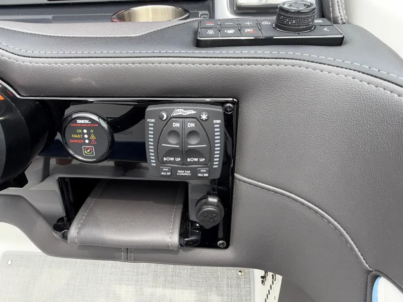 Slide: The Image of Control panel of 2025 Formula 270 Bowrider boat with trim and gauge controls. - 28
