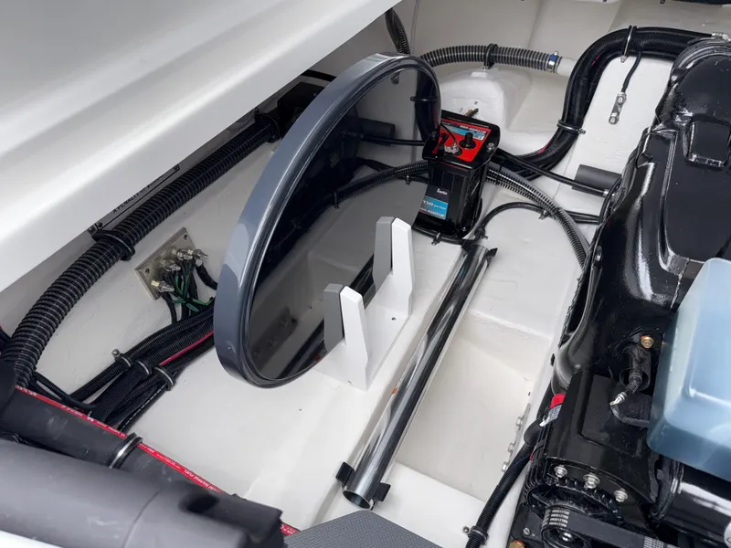 Slide: The Image of Engine compartment of 2025 Formula 270 Bowrider boat, showcasing wiring and components. - 34