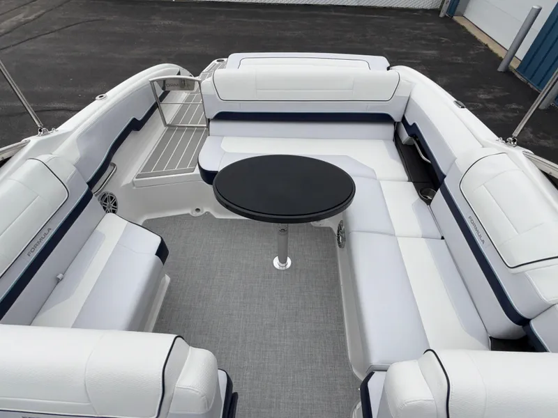 Slide: The Image of 2025 Formula 270 Bowrider interior with white seating and a central black table. - 38