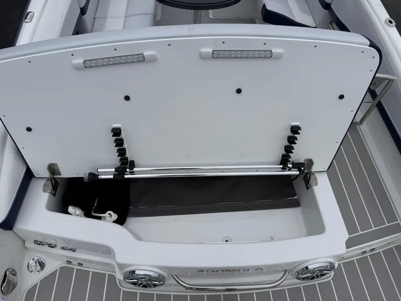 Slide: The Image of 2025 Formula 270 Bowrider boat interior with open storage compartment and sleek design. - 39