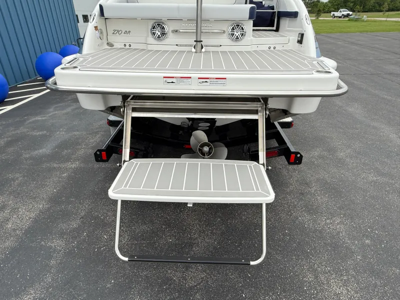 Slide: The Image of 2025 Formula 270 Bowrider boat with extended swim platform and ladder. - 7