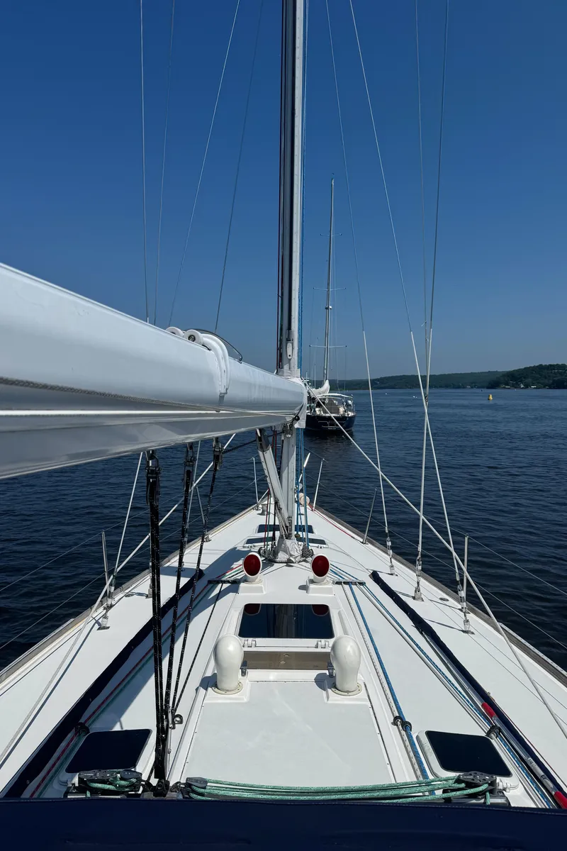 Slide: The Image of Sailing on a 1987 Sabre 42 yacht, calm waters, clear blue sky. - 8