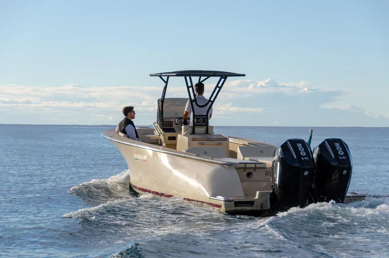 Slide: The Image of AlCustom Levanzo 25 boat cruising on open water, 2025 model. - 7