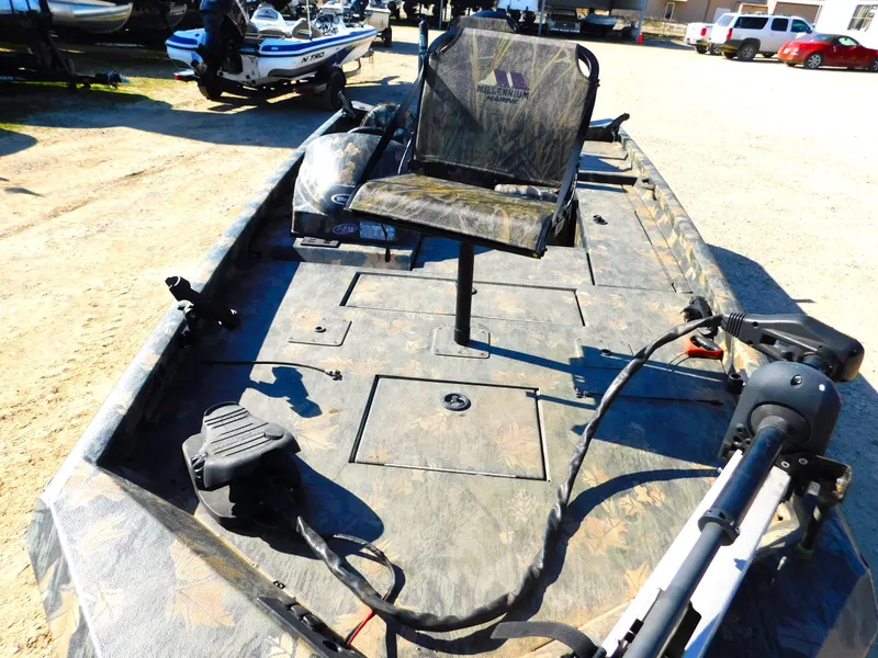 Slide: The Image of 2016 Triton 17 C TX fishing boat with camo seat and trolling motor. - 5