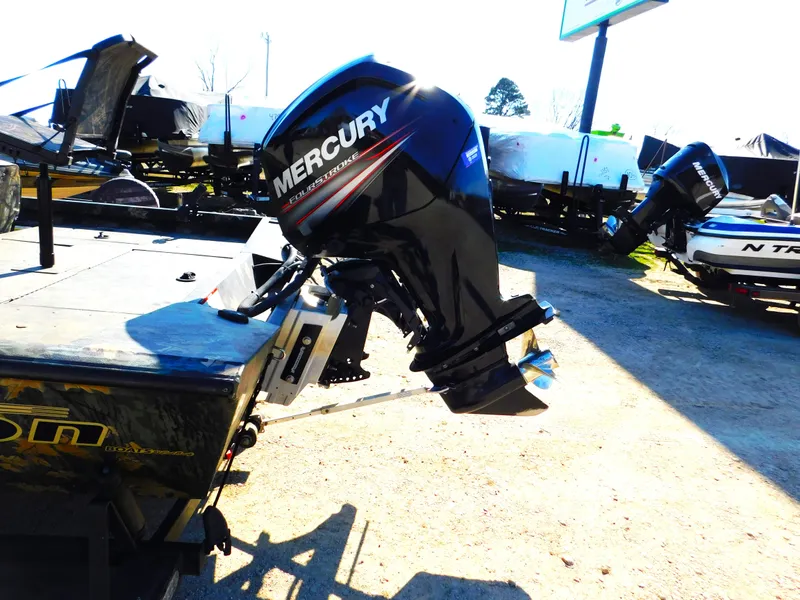 Slide: The Image of 2016 Triton 17 C TX boat with Mercury outboard motor in a sunny outdoor setting. - 9
