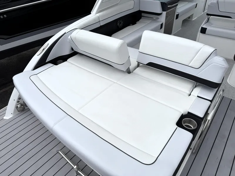 Slide: The Image of 2025 Formula 330 Crossover Bowrider I/O with luxurious white seating and sleek design. - 11