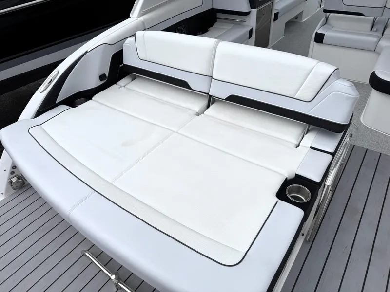 Slide: The Image of 2025 Formula 330 Crossover Bowrider I/O with luxurious white seating and sleek design. - 12