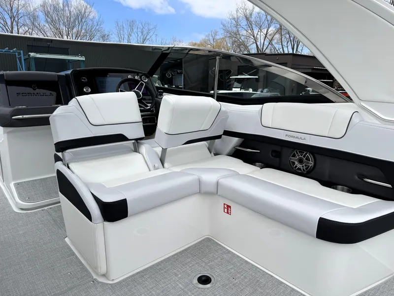 Slide: The Image of 2025 Formula 330 Crossover Bowrider I/O interior with luxurious seating and modern design. - 16