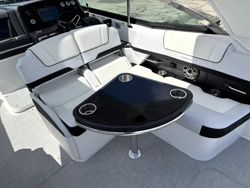 Slide: The Image of 2025 Formula 330 Crossover Bowrider I/O interior with sleek seating and modern dashboard. - 18