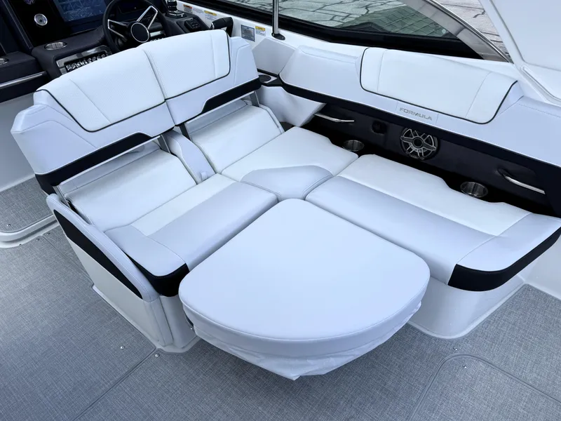 Slide: The Image of 2025 Formula 330 Crossover Bowrider I/O interior with luxurious white seating and modern design. - 19
