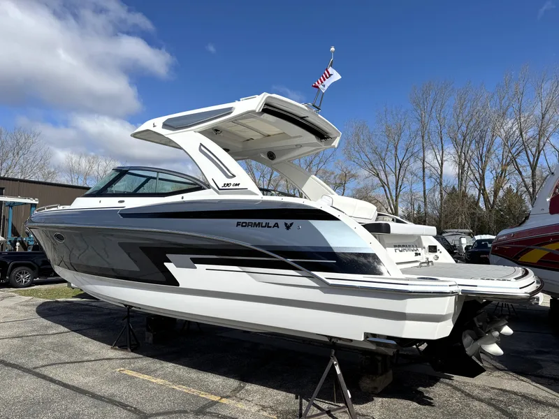 Slide: The Image of 2025 Formula 330 Crossover Bowrider I/O boat on display, featuring sleek design and modern features. - 2