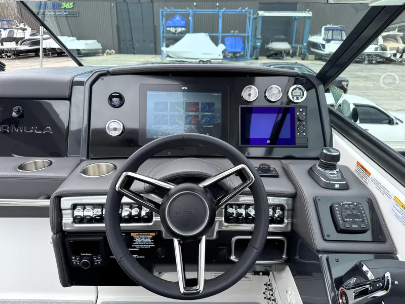 Slide: The Image of 2025 Formula 330 Crossover Bowrider I/O dashboard with modern controls and touchscreen display. - 22