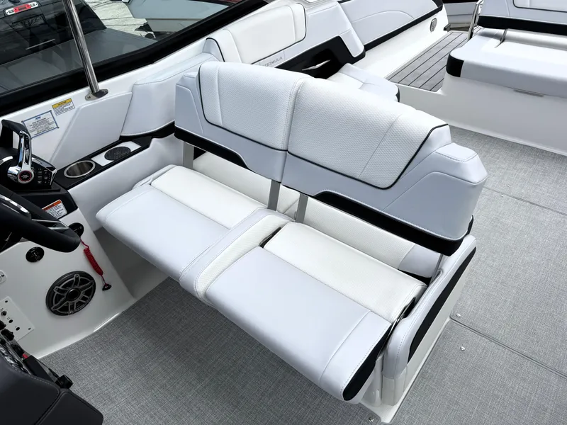 Slide: The Image of 2025 Formula 330 Crossover Bowrider I/O interior with white seating and modern design. - 23