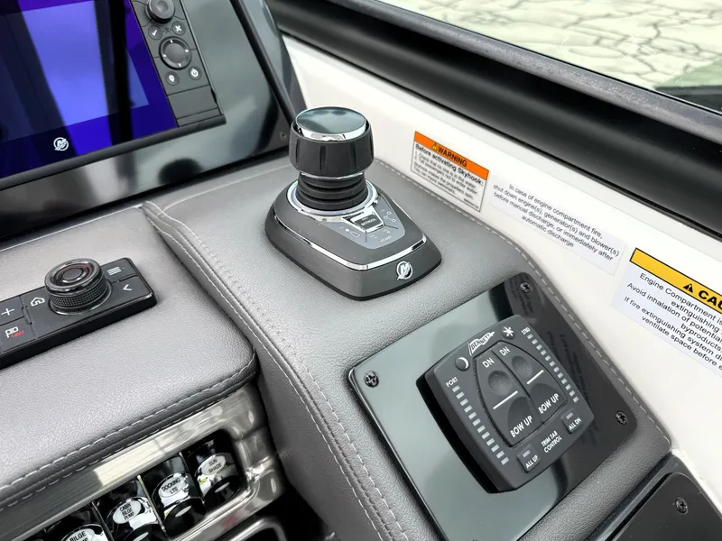 Slide: The Image of Control panel of 2025 Formula 330 Crossover Bowrider I/O with joystick and display. - 25