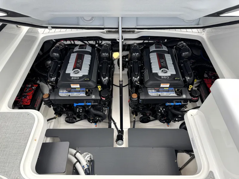 Slide: The Image of Twin engines in a 2025 Formula 330 Crossover Bowrider I/O boat. - 28