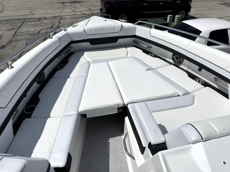 Slide: The Image of 2025 Formula 330 Crossover Bowrider I/O with spacious white seating and modern design. - 34