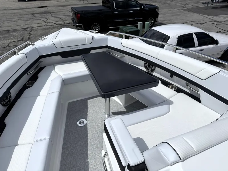 Slide: The Image of 2025 Formula 330 Crossover Bowrider I/O with spacious seating and sleek design. - 38