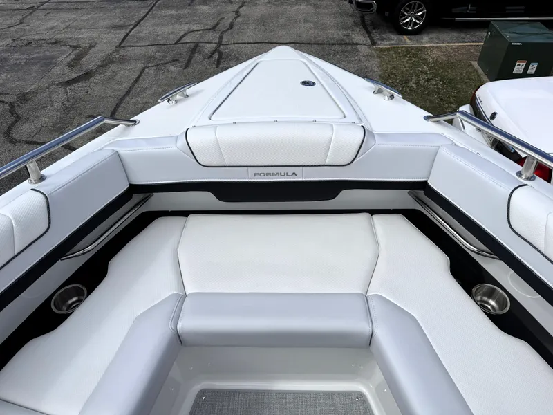 Slide: The Image of 2025 Formula 330 Crossover Bowrider I/O, luxurious white seating, sleek design. - 42