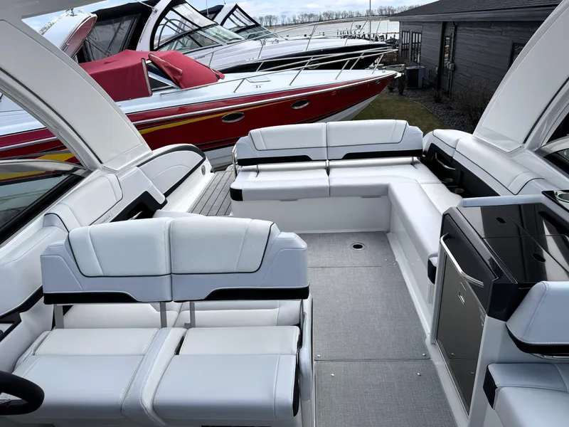 Slide: The Image of 2025 Formula 330 Crossover Bowrider I/O with luxurious seating and sleek design. - 45