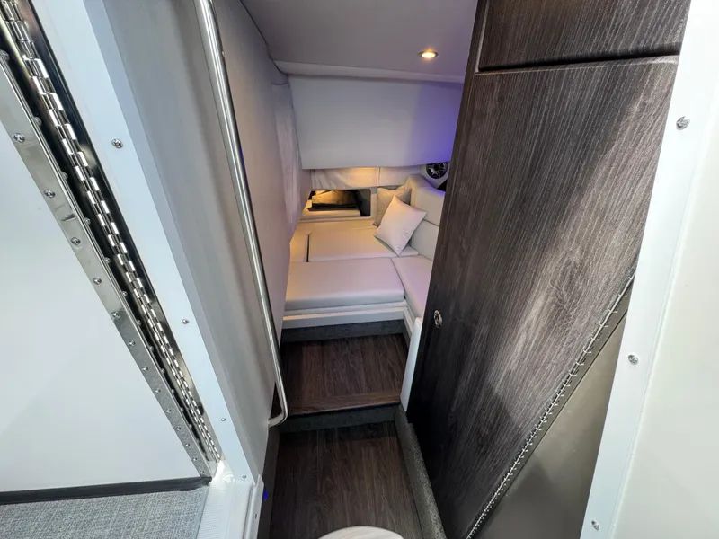 Slide: The Image of 2025 Formula 330 Crossover Bowrider I/O cabin interior with modern design and cozy seating. - 46