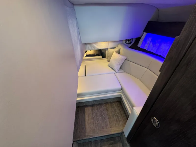 Slide: The Image of 2025 Formula 330 Crossover Bowrider I/O cabin with modern seating and ambient lighting. - 47