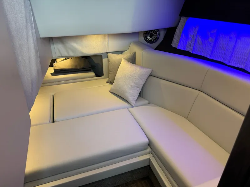 Slide: The Image of 2025 Formula 330 Crossover Bowrider I/O cabin with modern seating and ambient lighting. - 49
