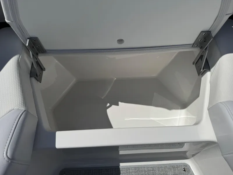 Slide: The Image of Storage compartment in 2025 Formula 330 Crossover Bowrider I/O boat, open and empty. - 9