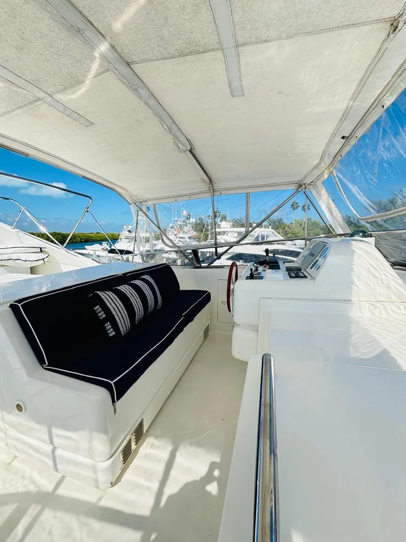 Slide: The Image of Falcon Motoryacht 2000 interior with black seating, steering wheel, and clear canopy. - 13